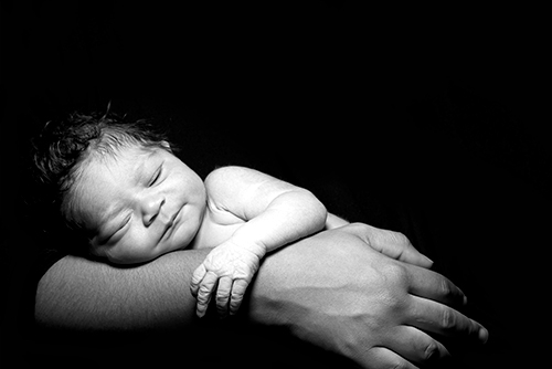 tiny baby in a mother's palm